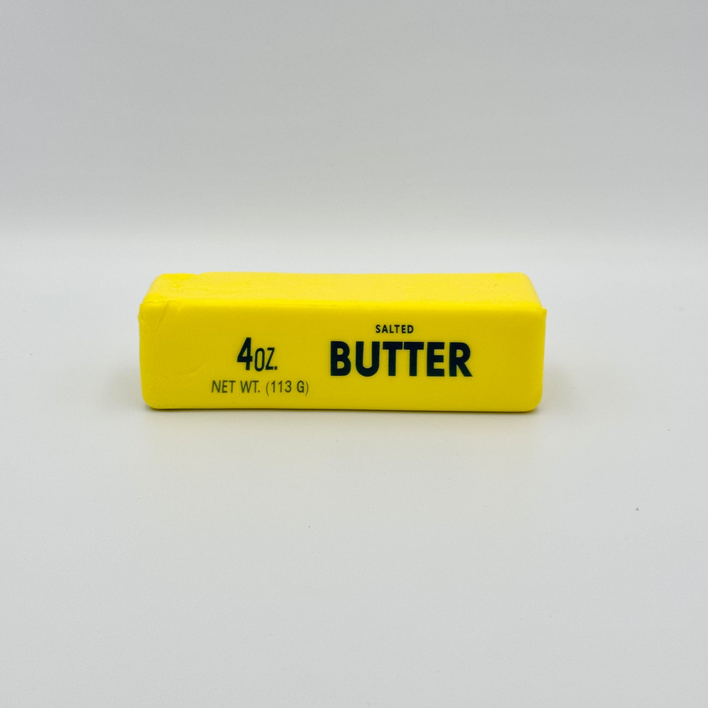 Gelbes Antistresstoy  in Form eines Butterstücks Salted Butter – Lustiges Squeezy Fidget 