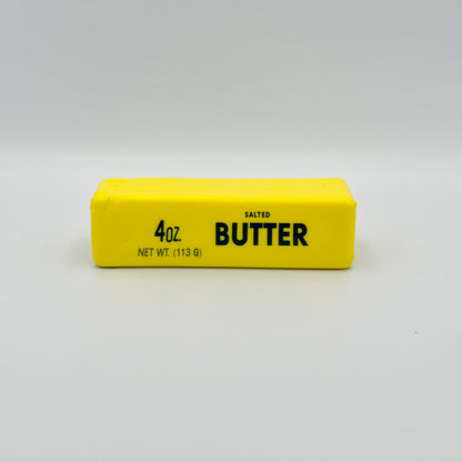 Gelbes Antistresstoy  in Form eines Butterstücks Salted Butter – Lustiges Squeezy Fidget 