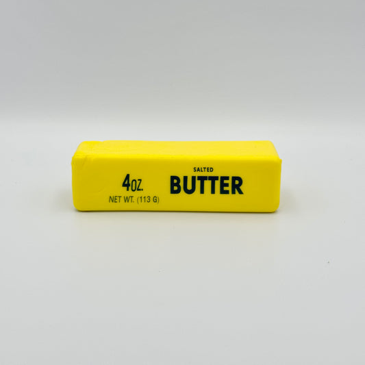 Gelbes Antistresstoy  in Form eines Butterstücks Salted Butter – Lustiges Squeezy Fidget 