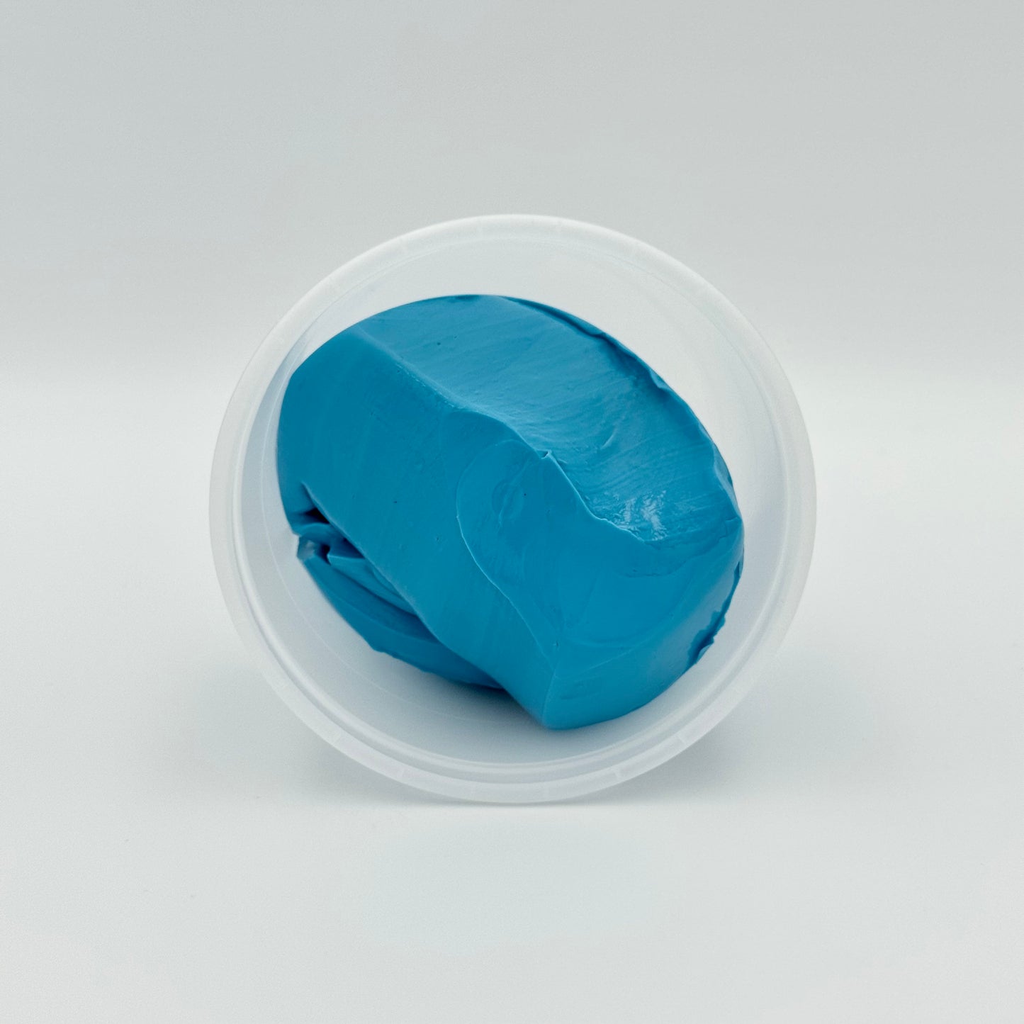 Geöffnete Dose mit blauer Therapieknete Stärke extra fest – Fitness Knete für Handtraining