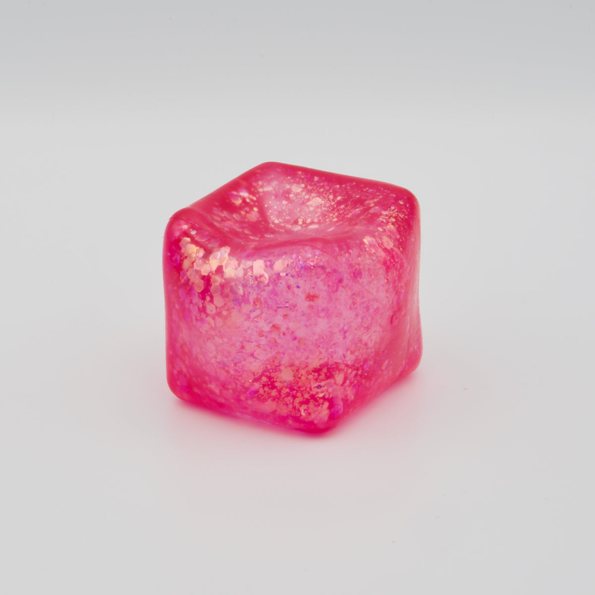Pinker Glitzer-Squeeze-Würfel mit elastischer Vertiefung auf der Oberseite