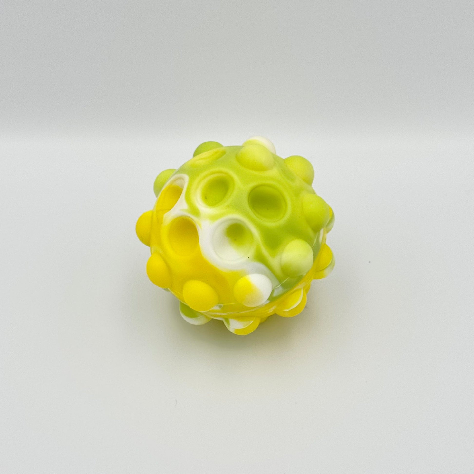 Gelber Pop It Squeeze Ball mit eingedrückten Blasen – Anti-Stress Fidget Toy aus Silikon