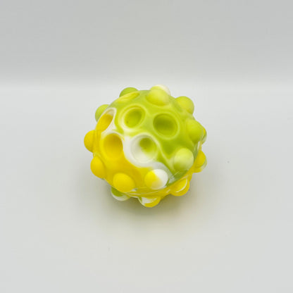 Gelber Pop It Squeeze Ball mit eingedrückten Blasen – Anti-Stress Fidget Toy aus Silikon