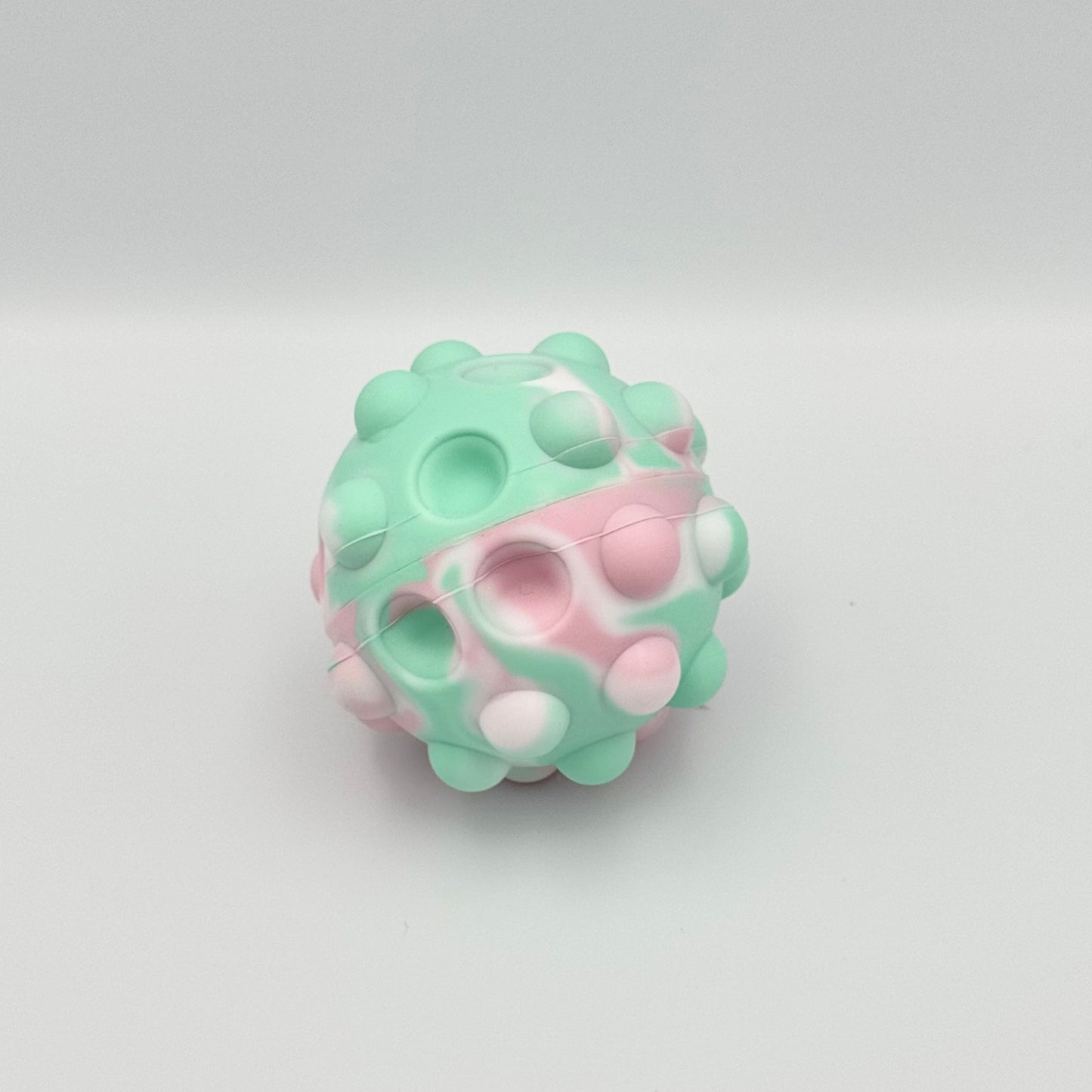 Pastellfarbener Pop It Squeeze Ball mit eingedrückten Blasen – Fidget Toy aus Silikon