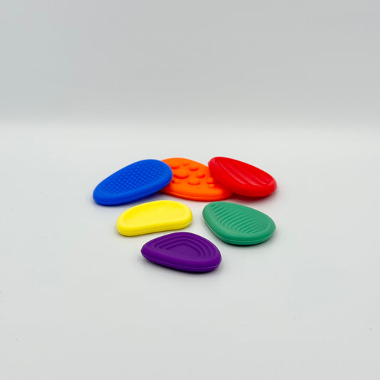 Bunte Worry Stones aus Silikon mit verschiedenen Oberflächen-Strukturen – Sorgensteine Set